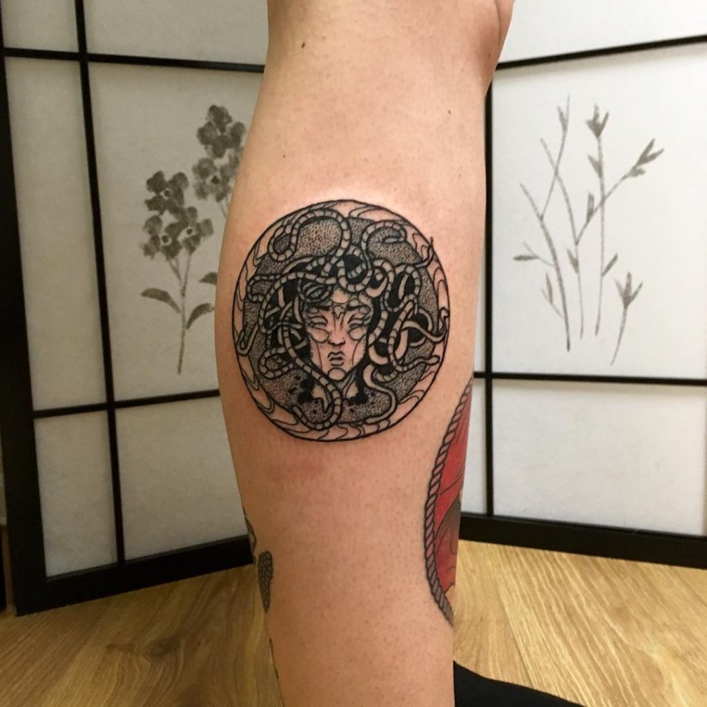 Circular black medusa tattoo by big carl tattooer