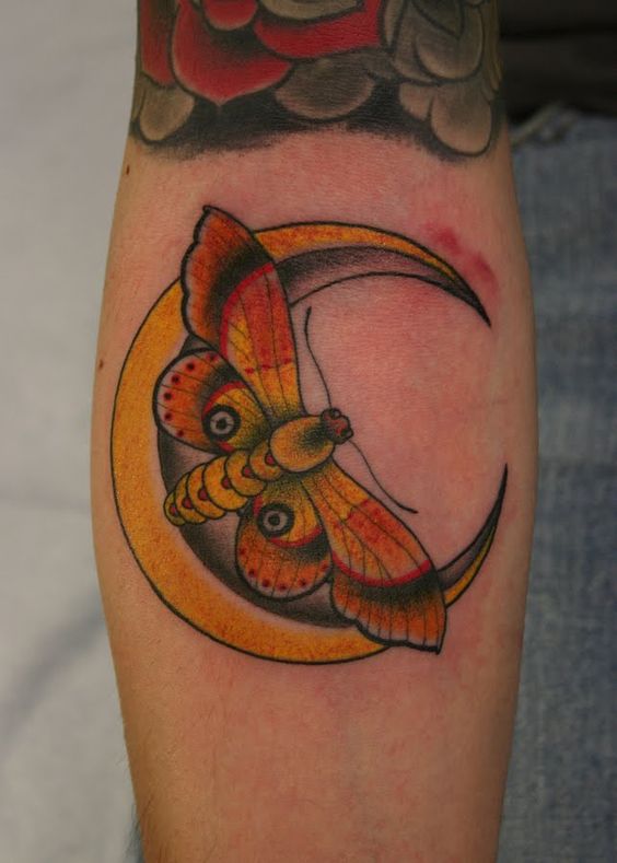 Colored moth and golden crescent moon tattoo