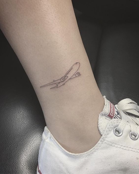 Cool aircraft tattoo on the right ankle