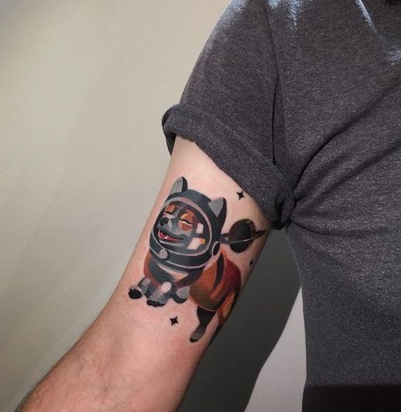 Corgi astronaut tattoo on the arm