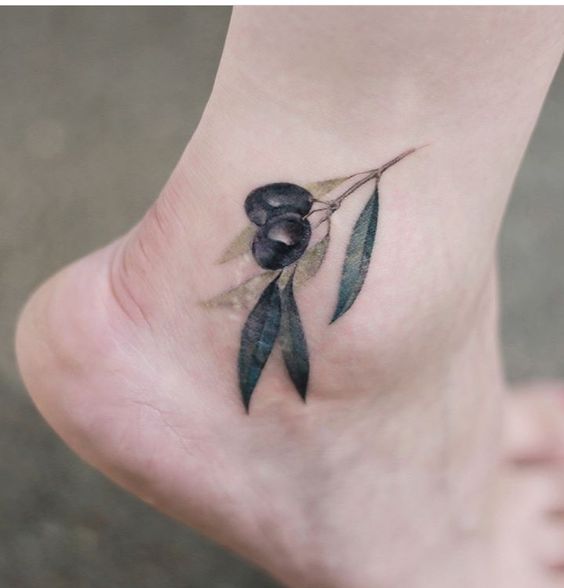 Delicate and realistic olive branch ankle tattoo