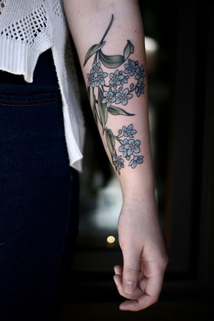 Delicate forget me not tattoo on the left forearm
