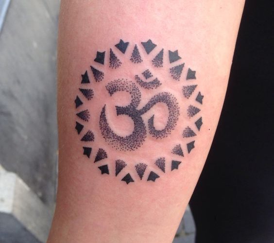 Dotwork om tattoo with black circular ornament around