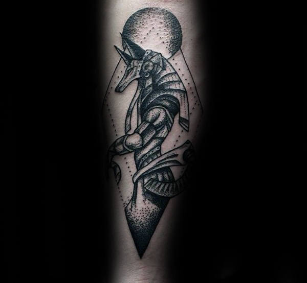 Dotwork style anubis in a rhombus tattoo