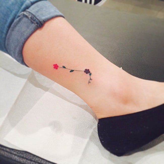 Floral aries constellation tattoo on the ankle