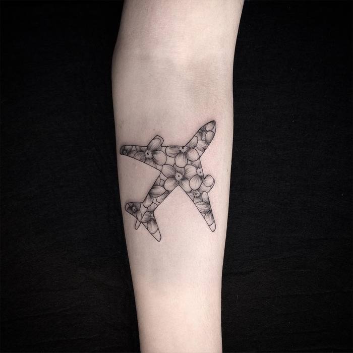 Floral plane tattoo