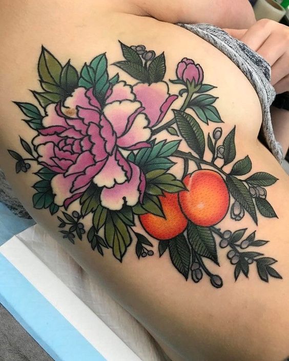 Flowers and peaches tattoo on the right rib