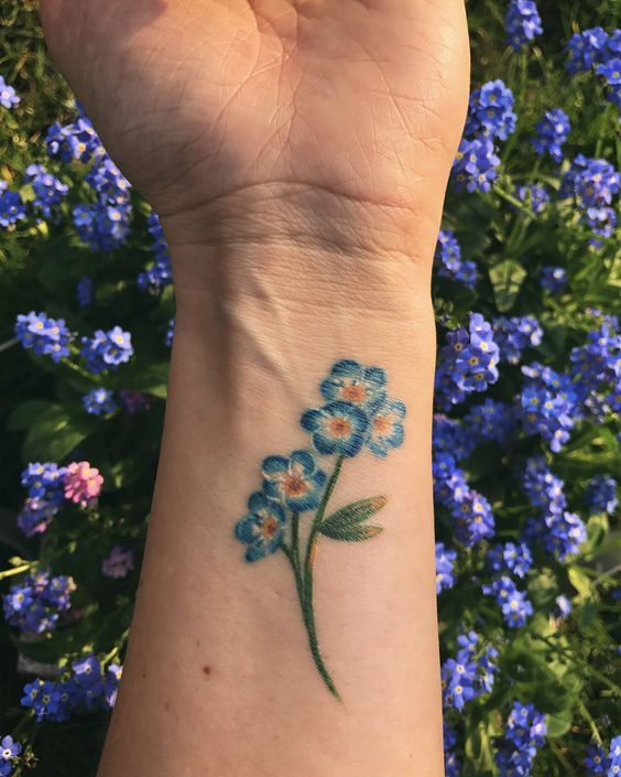 Forget me not tattoo on the left inner wrist