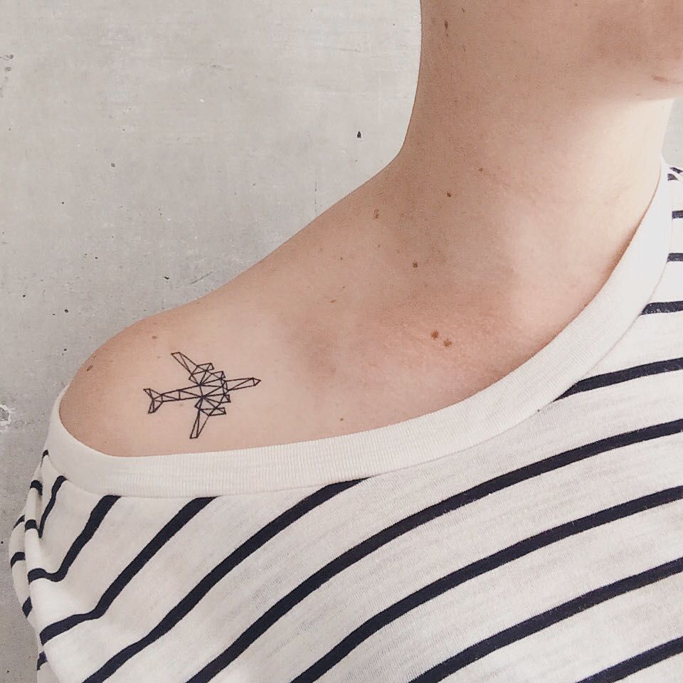 Geometric airplane on the right shoulder