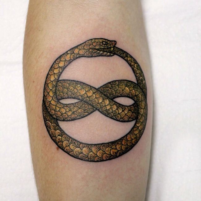 Golden snake ouroboros tattoo