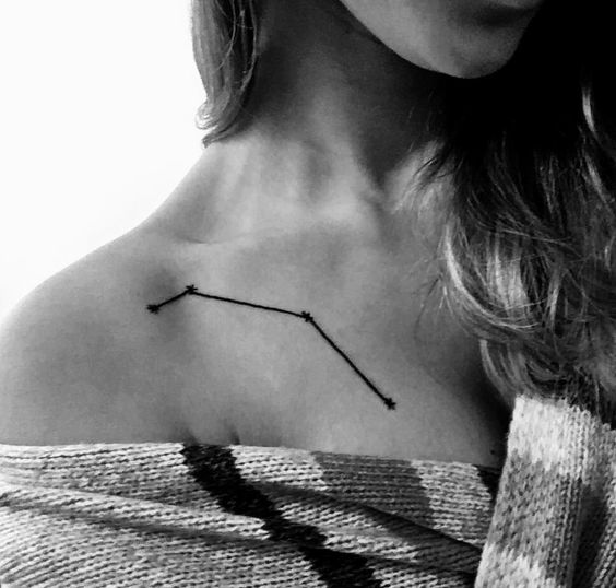 Gorgeous black linear aries constellation tattoo on the chest