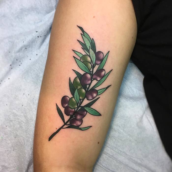 Green and purple olive branch tattoo
