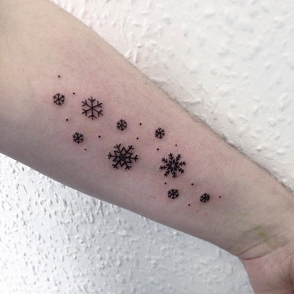 Group of snowflakes tattoo on the forearm