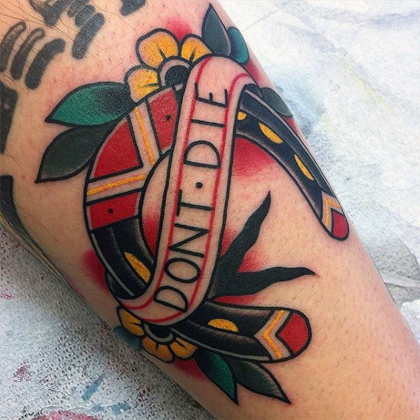 Horseshoe tattoo with a dont die banner