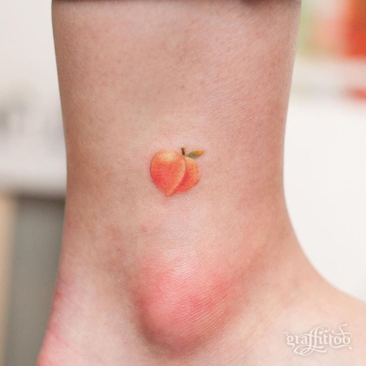 Hyper realistic little peach tattoo on the inner ankle