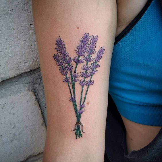 Lavender bouquet tattoo on the right upper arm