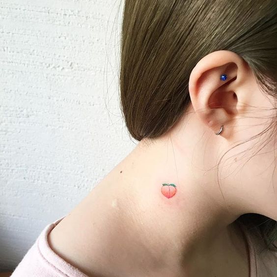 Little peach tattoo on the neck