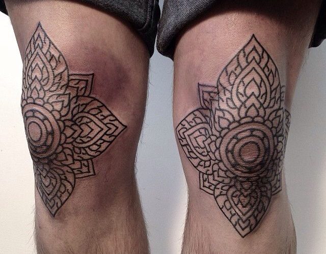 Matching black ornamental knee tattoos