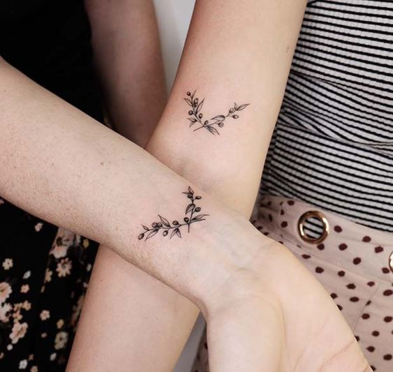 Matching olive branch wrist tattoos for best friends