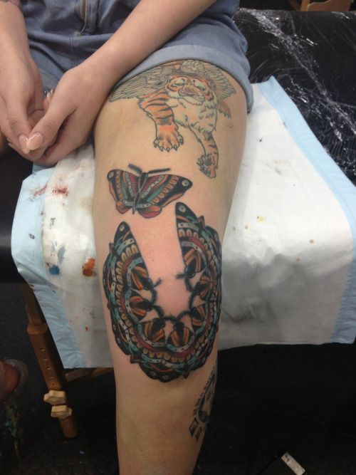 Moth mandala knee tattoo. 