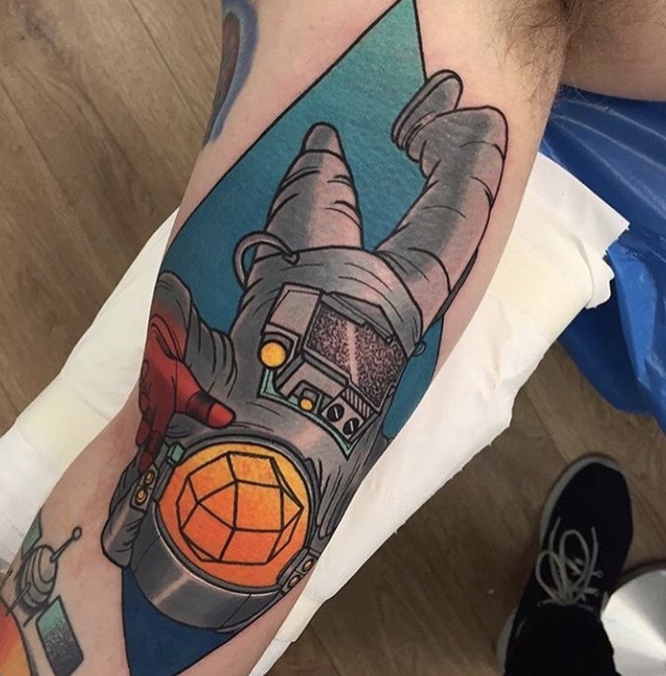 Neo traditional abstract astronaut tattoo