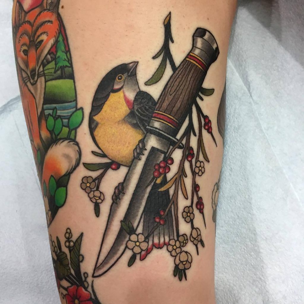 Neo traditional knife bird and a branch with berries tattoo