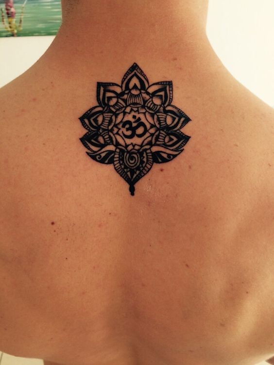 Om symbol in the lotus flower on the back
