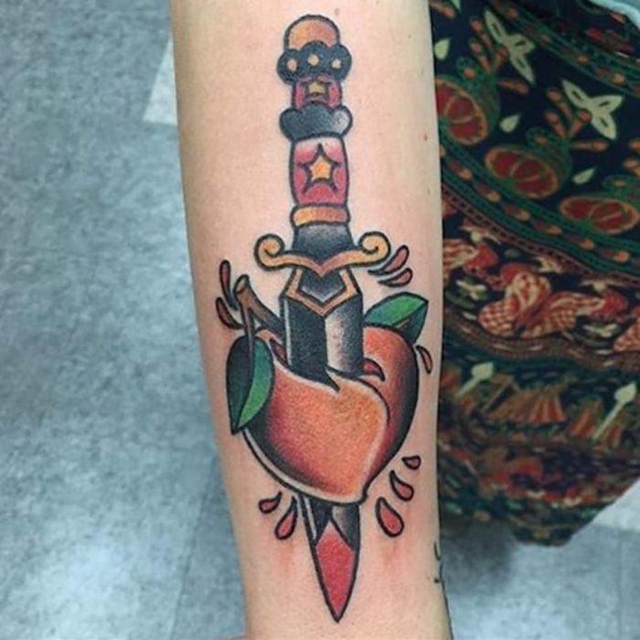 Peached stabbed with the dagger tattoo