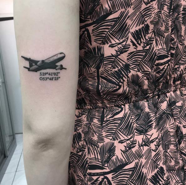 Realistic airplane tattoo with the coordinates