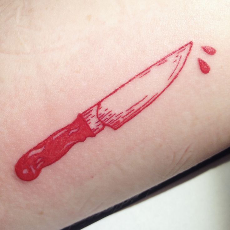 Red knife and blood tattoo