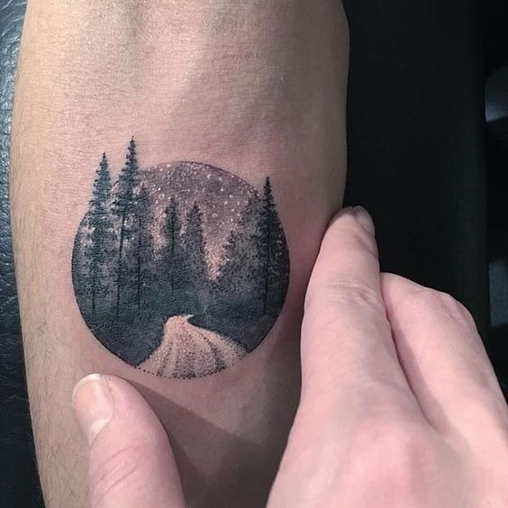 Road in the middle of the woods tattoo