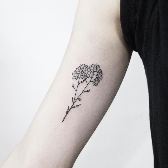 Small black forget me nots on the right arm