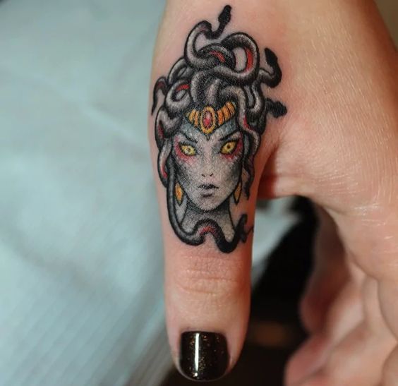 Small colorful medusa on the left thumb