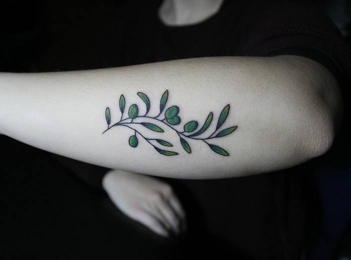 Small green olive on the forearm