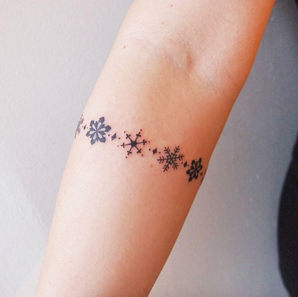 Snowflake armband tattoo