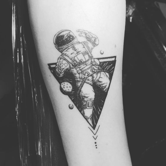 Spaceman tattoo in a triangle