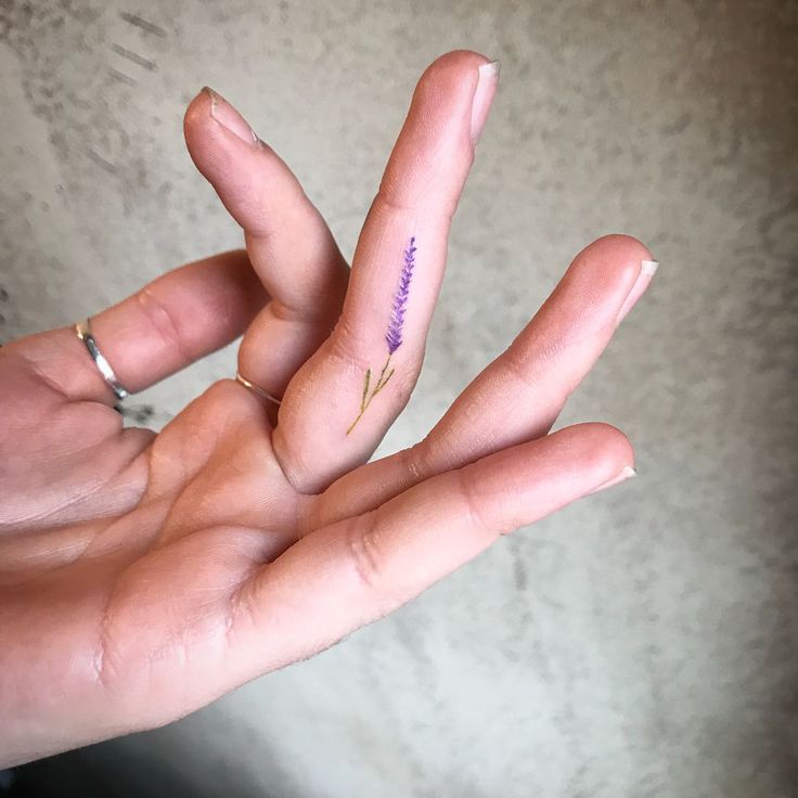 Super delicate small lavender tattoo on the finger
