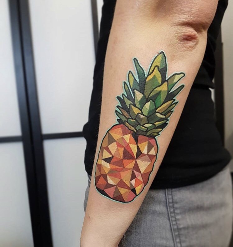 Tattoo of a colorful and geometric pineapple