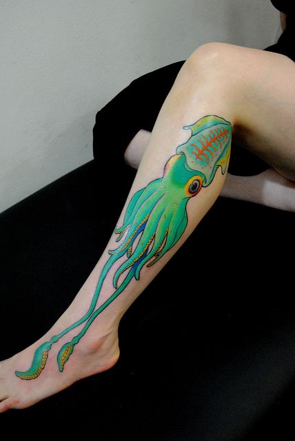 Teal blue squid on the leg