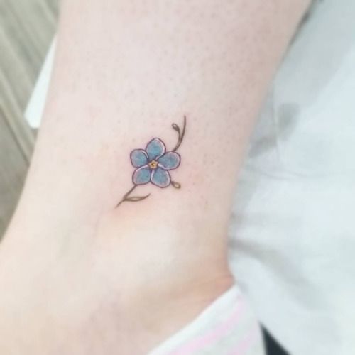 Tiny forget me not tattoo on the ankle