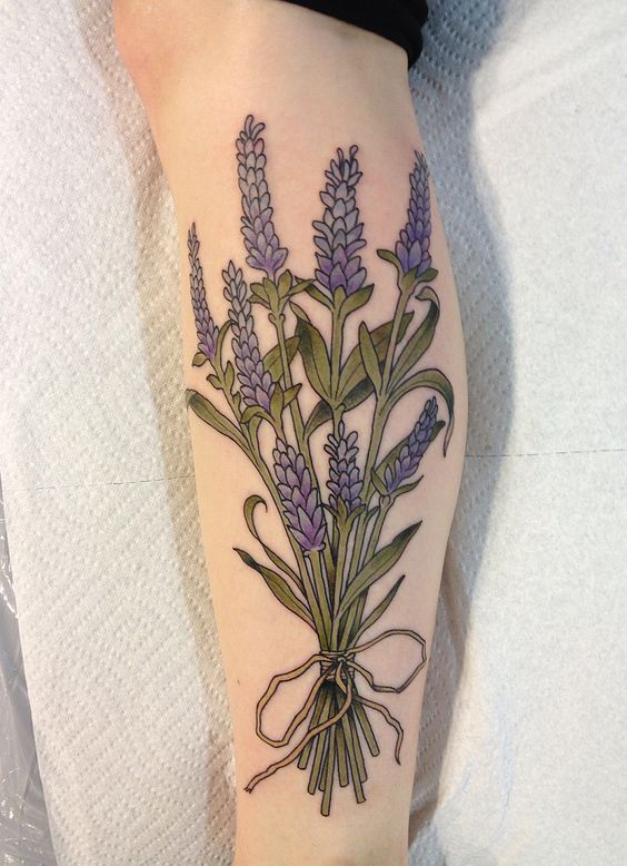 Traditional lavender bouquet tattoo on the left calf