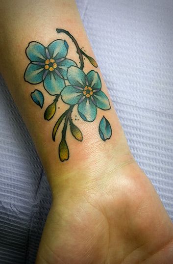 Traditional style forget me not tattoo on the inner wrist