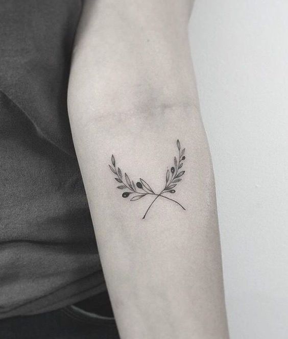 Two olive branches on the left inner arm