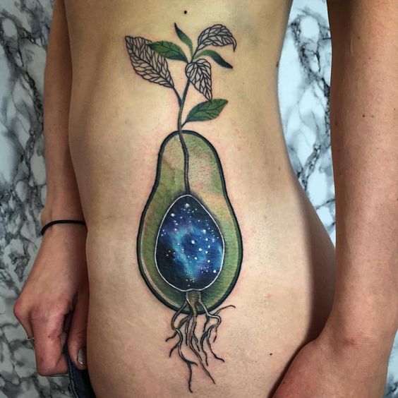 Avocado tattoo with a galactic center