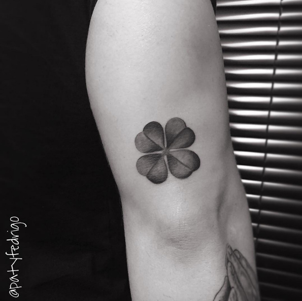 Black and grey four leaf clover tattoo