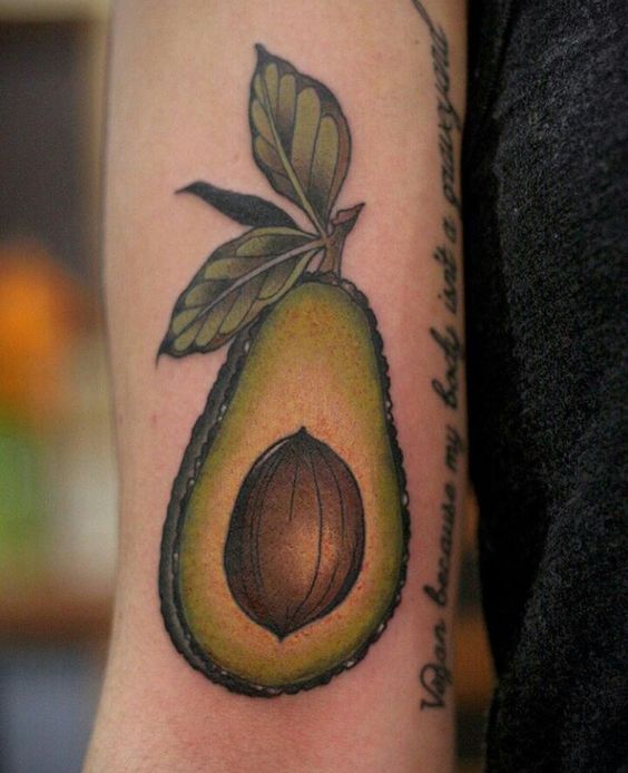 Colorful avocado tattoo on the arm
