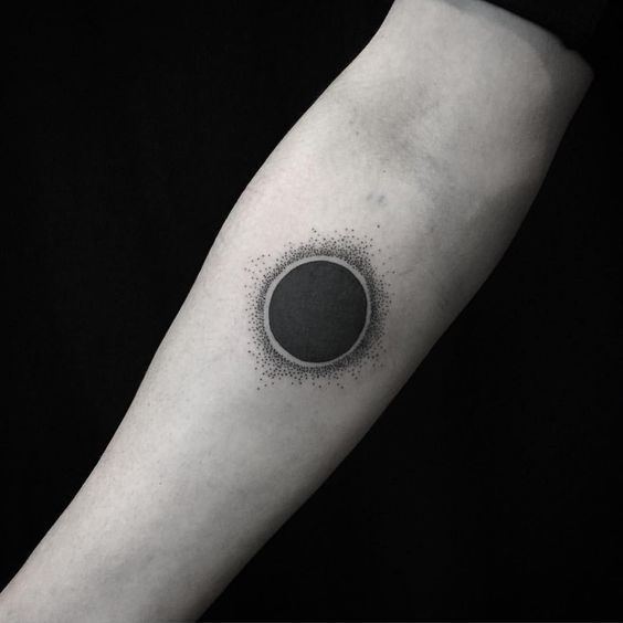Dotwork solar eclipse tattoo