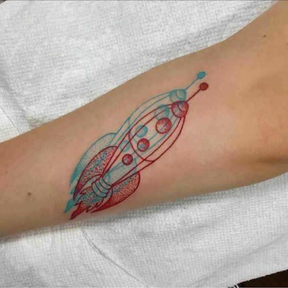 Double outline rocket on the forearm