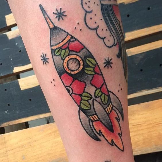 Floral flying spaceship tattoo
