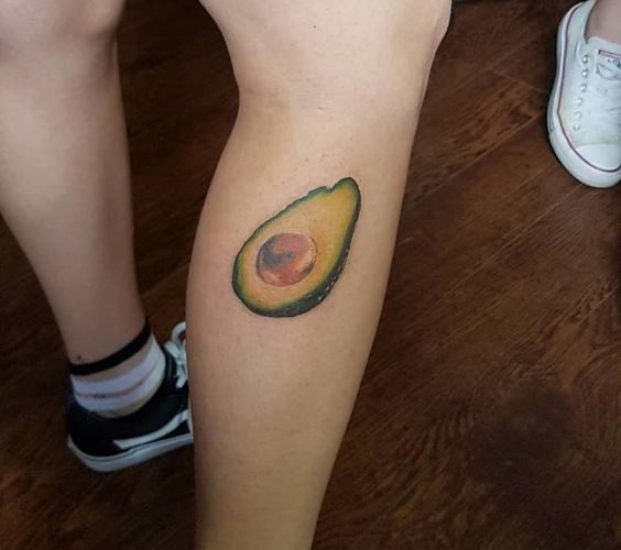 Hyper realistic avocado tattoo on the right calf